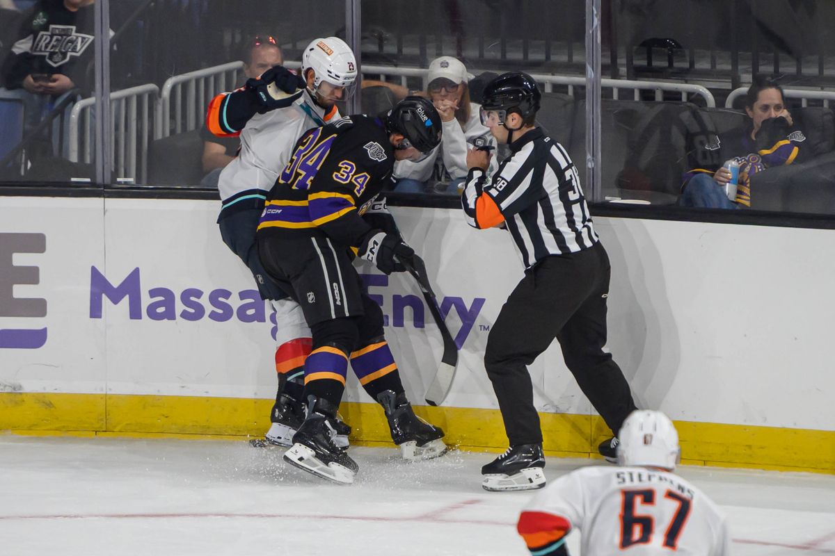 Ontario Reign forward Taylor Ward (34) battles for the puck during an AHL hockey game against Coachella Valley Firebirds, Saturday, Oct. 3, 2026, in Ontario, California. Ontario Reign forward Taylor Ward (34) battles for the puck during an AHL hockey game against Coachella Valley Firebirds, Saturday, Oct. 3, 2026, in Ontario, California.