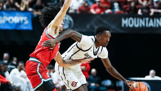 San Diego State BJ Davis (10) drives past New Mexico Uriah Tenette (4) during the semifinal Mountain West Championship tournament game between San Diego State and New Mexico on Friday March 13, 2026 in Las Vegas, Nev.