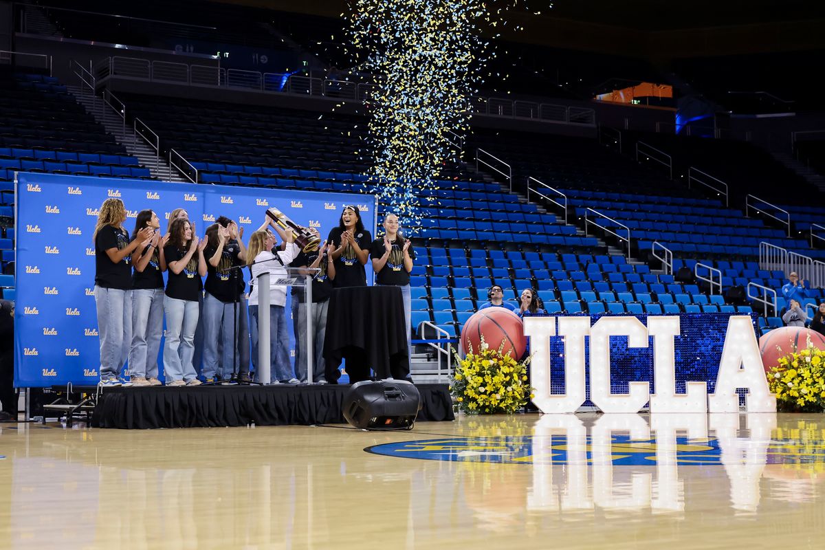 The UCLA Bruins hold up their trophy during the celebration for the NCAA Champion UCLA Bruins Women’s basketball team, Wednesday April 8, 2026, in Los Angeles, Calif.