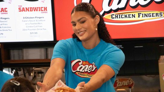 From raising trophies to Raising Cane's: Lauren Betts and Kiki Rice clock in taken at Raising Cane's (UCLA). Photo by Jack Haslett