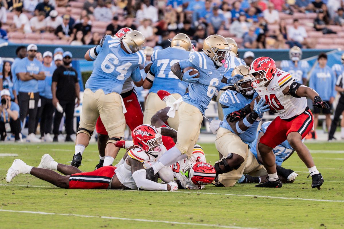 #6 Anthony Woods of UCLA breaks a tackle during an NCAA football game against Maryland Terrapinson October 18, 2025 in Pasadena, CA.