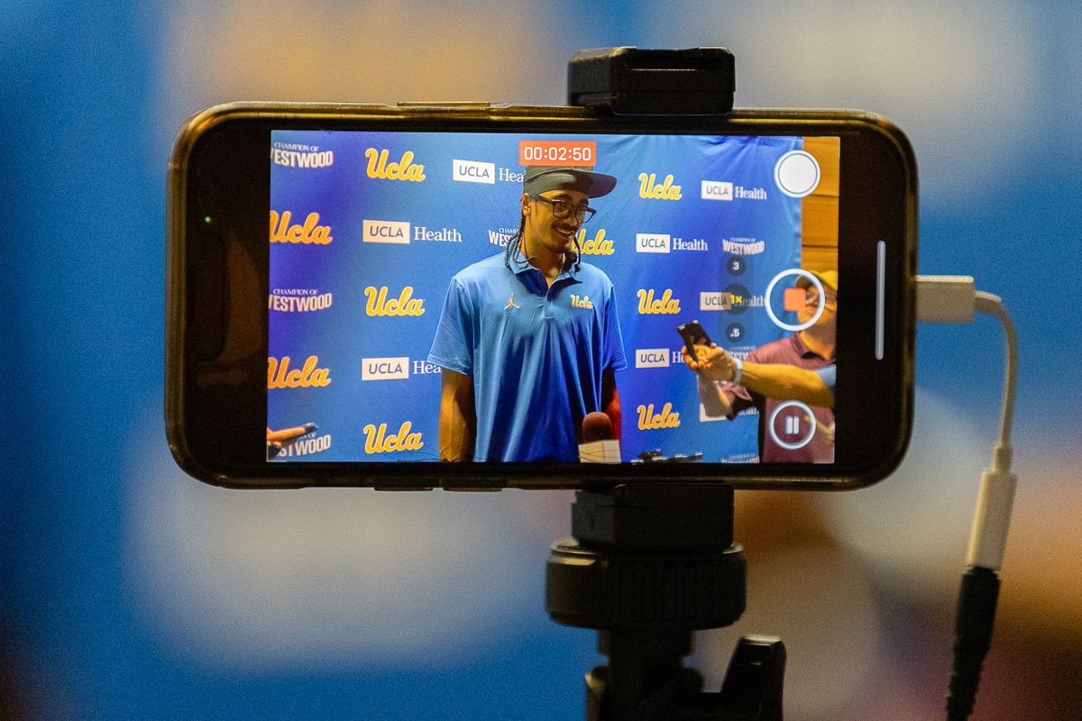 Media member records UCLA quarterback Nico Iamaleava during media day at Pavilion Club in Pauley Pavilion, Los Angeles. Media member records UCLA quarterback Nico Iamaleava during media day at Pavilion Club in Pauley Pavilion, Los Angeles.