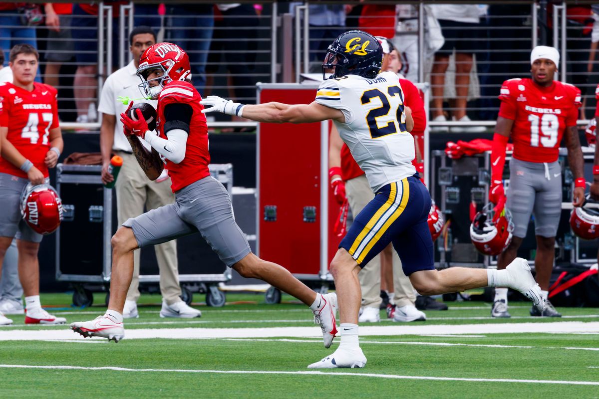 UNLV Football wide receiver Kayden McGee (6) catches the past from UNLV Football quarterback Jackson Arnold (11) and scores a touchdown during the first quarter of a game on Saturday, October 3, 2026, at Allegiant Stadium.