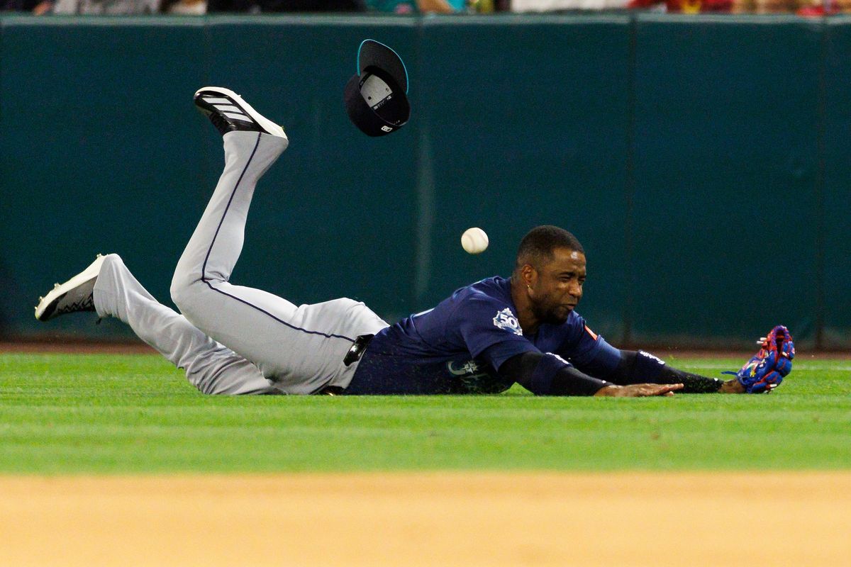 Victor Robles #10 of the Seattle Mariners dives for the ball during the game against the Los Angeles Angels at Angel Stadium of Anaheim on April 3, 2026 in Anaheim, California. 