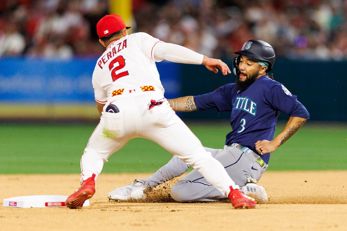 Oswald Peraza #2 of the Los Angeles Angels tags J.P. Crawford #3 of the Seattle Mariners at second base during the game at Angel Stadium of Anaheim on April 3, 2026 in Anaheim, California.