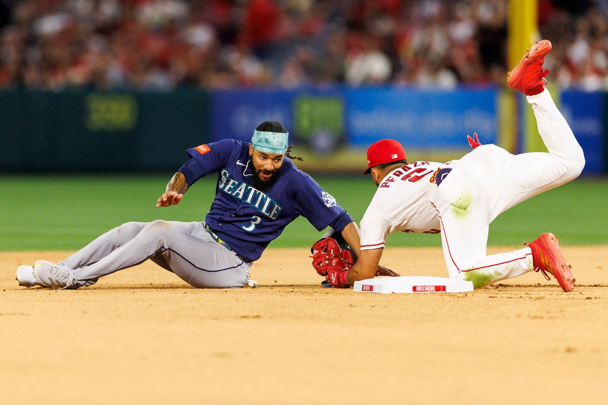 Oswald Peraza #2 of the Los Angeles Angels tags J.P. Crawford #3 of the Seattle Mariners at second base during the game at Angel Stadium of Anaheim on April 3, 2026 in Anaheim, California.