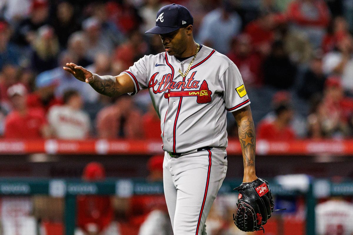 Rasiel Iglesias #26 of the Atlanta Braves celebrates after an inning-ending strikeout during an MLB game against the Los Angeles Angels at Angel Stadium on April 7, 2026 in Anaheim, California.