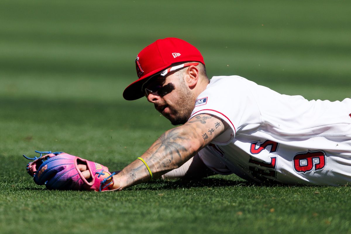 Zach Neto #9 of the Los Angeles Angels dives for a ground ball during the game against the Atlanta Braves at Angel Stadium of Anaheim on April 8, 2026 in Anaheim, California.