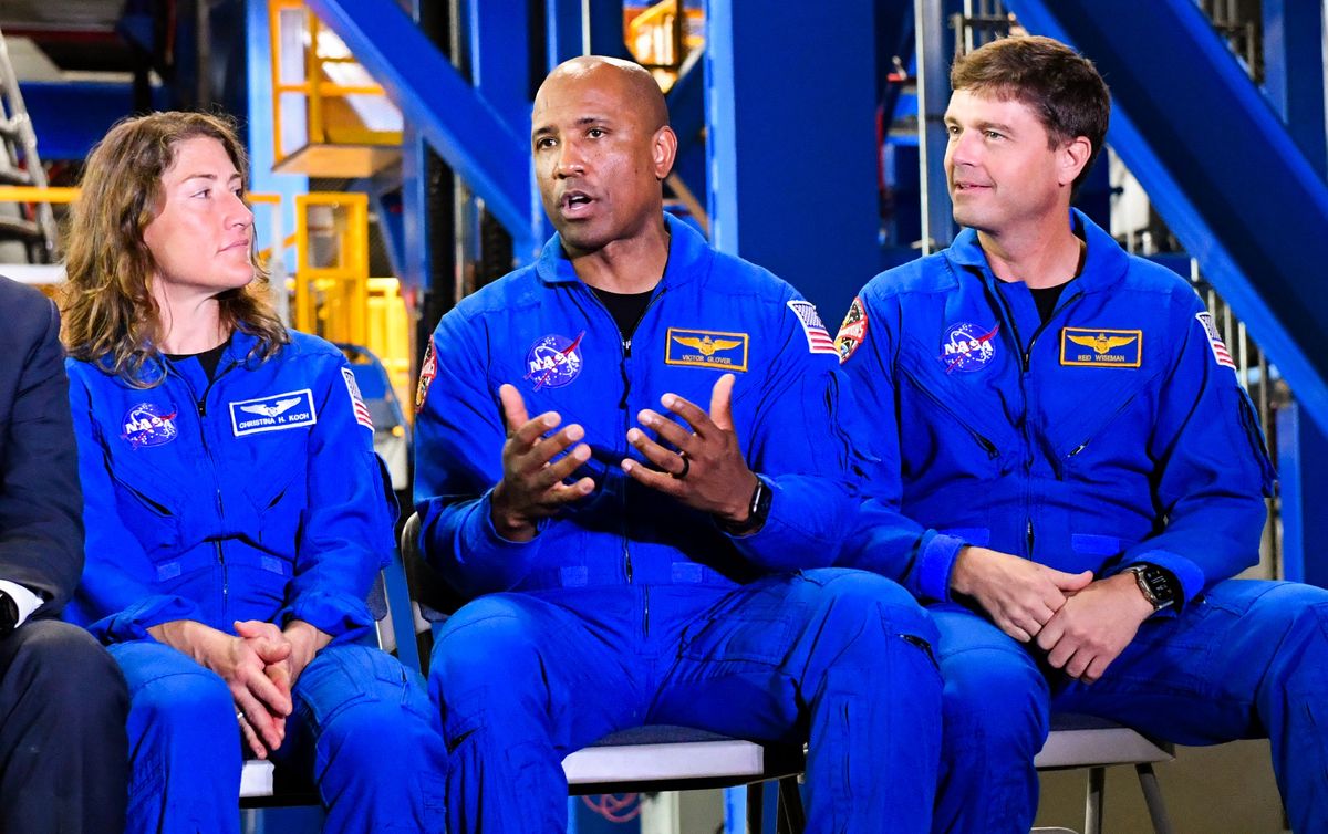 Cristina Koch Artemis II mission specialist (left), and commander Reid Wiseman (right) listen to pilot Victor Glover as they talk about their upcoming mission during a press conference at Kennedy Space Center, FL Monday, December 16, 2024 . Craig Bailey/FLORIDA TODAY via USA TODAY NETWORK Cristina Koch Artemis II mission specialist (left), and commander Reid Wiseman (right) listen to pilot Victor Glover as they talk about their upcoming mission during a press conference at Kennedy Space Center, FL Monday, December 16, 2024 . Craig Bailey/FLORIDA TODAY via USA TODAY NETWORK