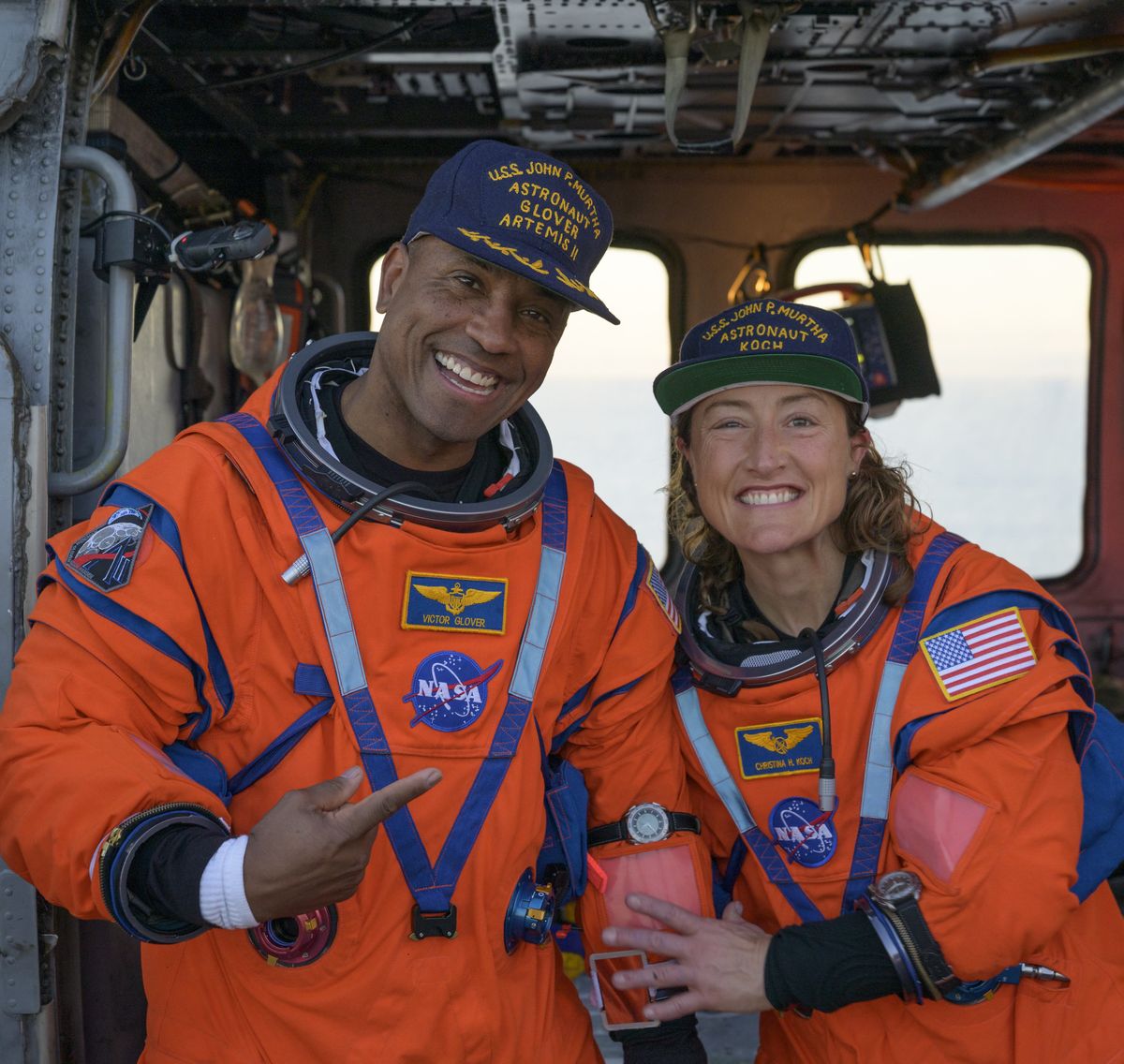 NASA astronaut Victor Glover, Artemis II pilot, left, and NASA astronaut Christina Koch, Artemis II mission specialist, sit on a Navy MH-60 Seahawk from Helicopter Sea Combat Squadron 23 on the flight deck of USS John P. Murtha after they and crewmates Canadian Space Agency astronaut Jeremy Hansen, Artemis II mission specialist, and NASA astronaut Reid Wiseman, Artemis II commander, were extracted from their Orion spacecraft after splashdown, April 10 in the Pacific Ocean off the coast of California. NASA astronaut Victor Glover, Artemis II pilot, left, and NASA astronaut Christina Koch, Artemis II mission specialist, sit on a Navy MH-60 Seahawk from Helicopter Sea Combat Squadron 23 on the flight deck of USS John P. Murtha after they and crewmates Canadian Space Agency astronaut Jeremy Hansen, Artemis II mission specialist, and NASA astronaut Reid Wiseman, Artemis II commander, were extracted from their Orion spacecraft after splashdown, April 10 in the Pacific Ocean off the coast of California.