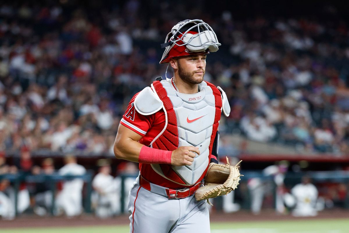 Logan O'Hoppe #14 of the Los Angeles Angels jogs to the dugout against Arizona Diamondbacks at Chase Field on June 16, 2026 in Phoenix, Arizona.