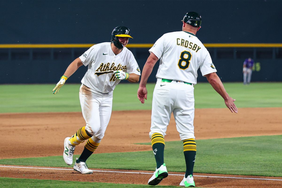 Athletics 1B Nick Kurtz (16) goes to high five third base coach Bobby Crosby (8) after hitting a home run against the Colorado Rockies on Friday June 12, 2026, at the Las Vegas Ballpark in Las Vegas, Nevada. Athletics 1B Nick Kurtz (16) goes to high five third base coach Bobby Crosby (8) after hitting a home run against the Colorado Rockies on Friday June 12, 2026, at the Las Vegas Ballpark in Las Vegas, Nevada.