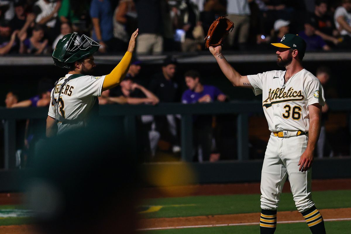 Athletics C Shea Langeliers (23) and LHP Hogan Harris (36) high-five after defeating the Colorado Rockies on Friday June 12, 2026, at the Las Vegas Ballpark in Las Vegas, Nevada. Athletics C Shea Langeliers (23) and LHP Hogan Harris (36) high-five after defeating the Colorado Rockies on Friday June 12, 2026, at the Las Vegas Ballpark in Las Vegas, Nevada.