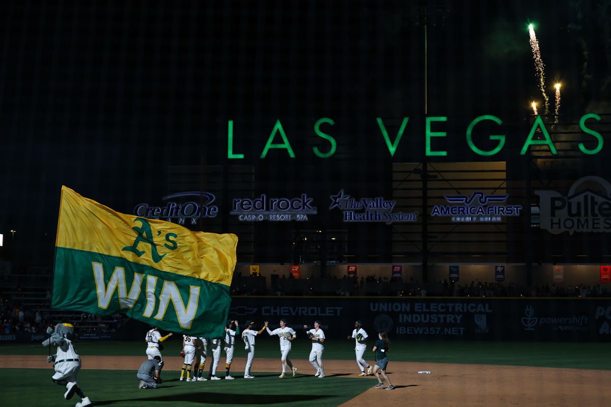 Athletics mascot Stomper carries the “A’s Win” flag across the field after the Athletics defeated the Colorado Rockies, 6-4, on Friday June 12, 2026, at the Las Vegas Ballpark in Las Vegas, Nevada. Athletics mascot Stomper carries the “A’s Win” flag across the field after the Athletics defeated the Colorado Rockies, 6-4, on Friday June 12, 2026, at the Las Vegas Ballpark in Las Vegas, Nevada.