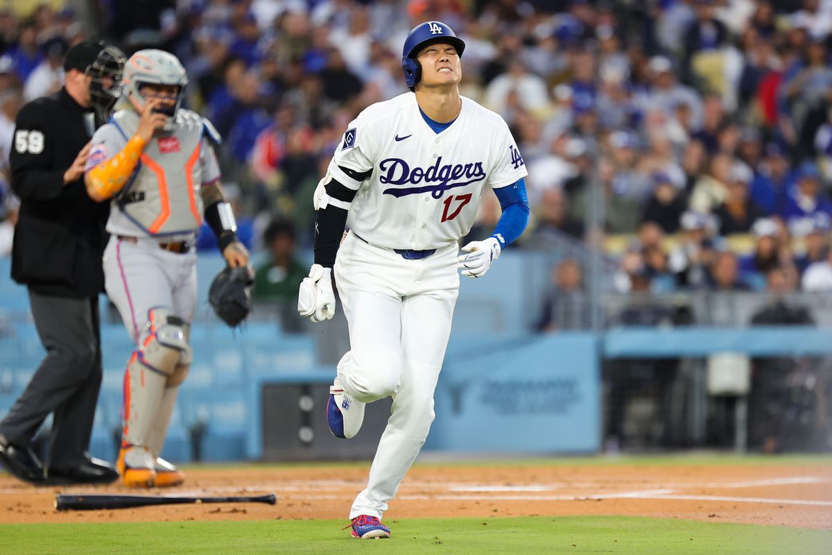 Shohei Ohtani #17 of the Los Angeles Dodgers runs to first base after being hit by a pitch during an MLB game against the New York Mets on April 13, 2026 in Los Angeles, CA. 