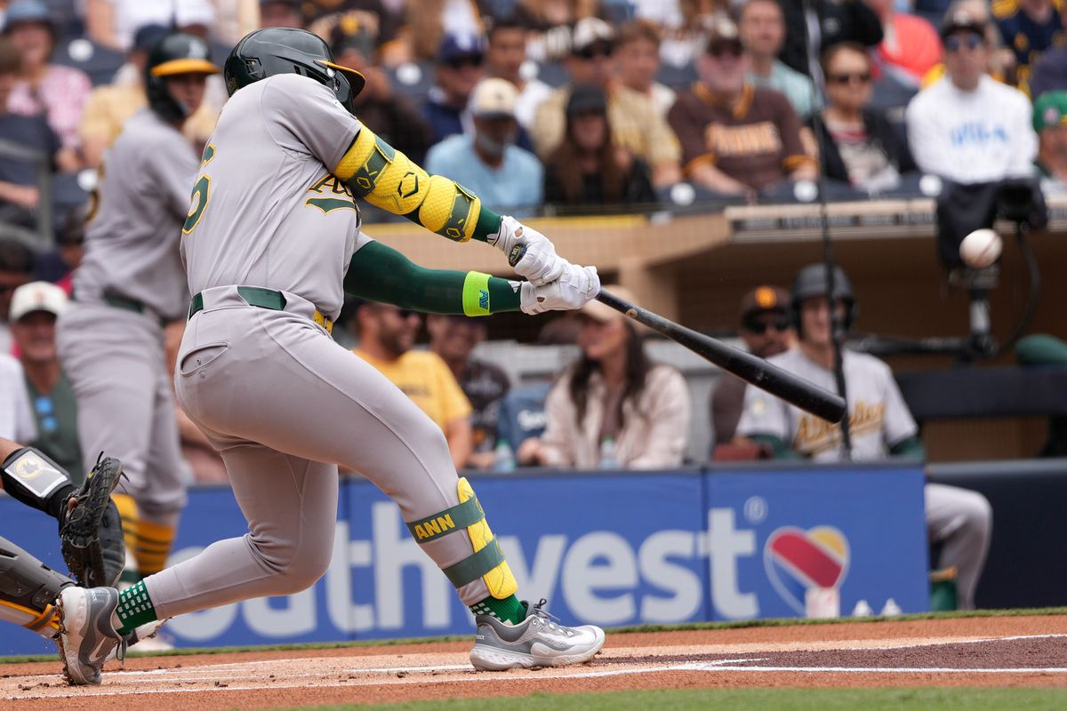 Athletics right fielder Carlos Cortes (26) hits a home run during an MLB baseball game against the Padres, Sunday May 24, 2026 in San Diego, California.