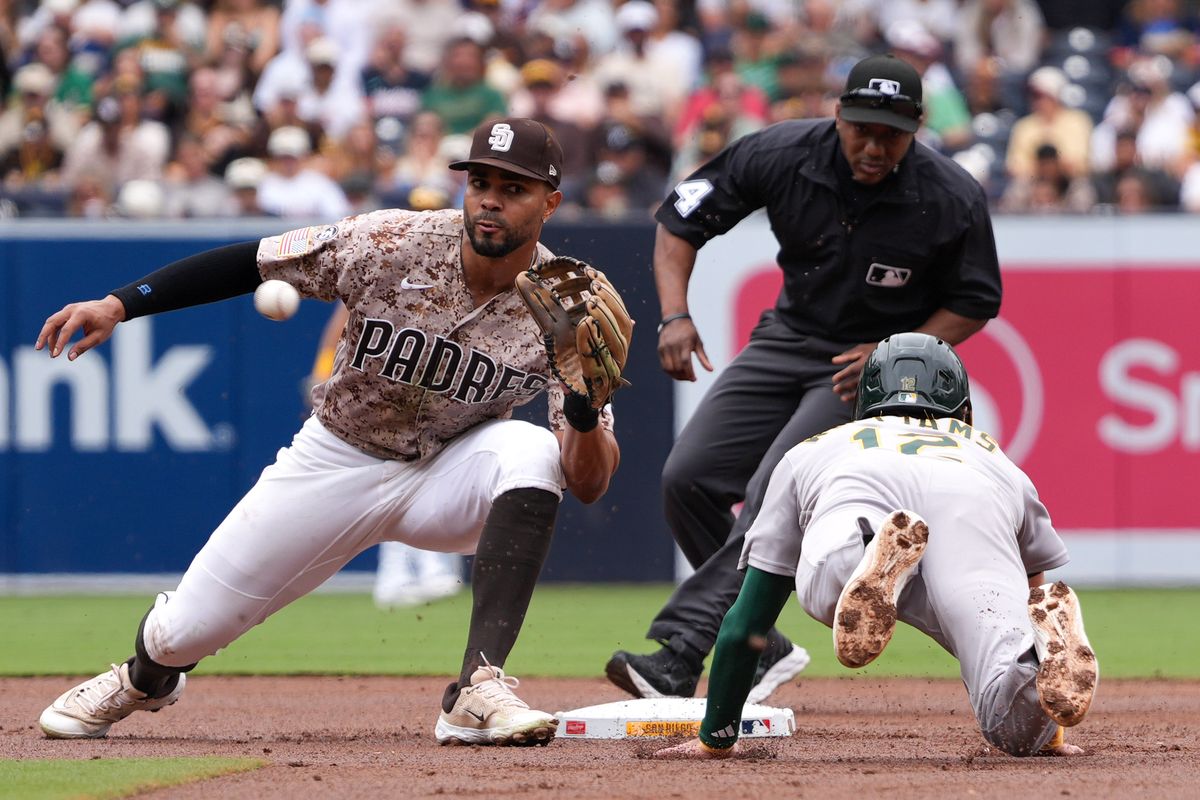 Athletics second baseman Alika Williams (12) slides to second base during an MLB baseball game against the Padres, Sunday May 24, 2026 in San Diego, California.