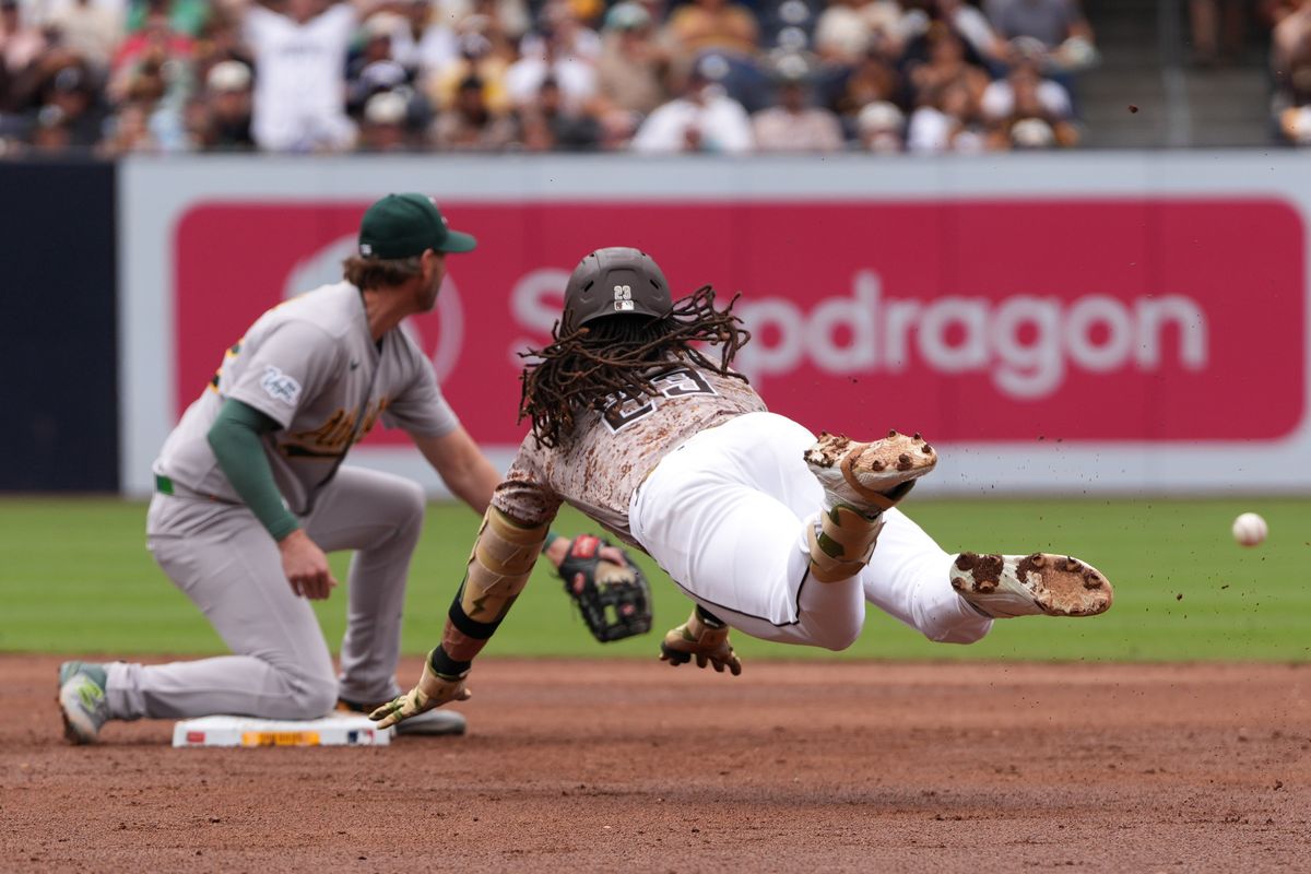 Padres right fielder Fernando Tatis Jr. (23) slides to second base during an MLB baseball game against the Athletics, Sunday May 24, 2026 in San Diego, California.