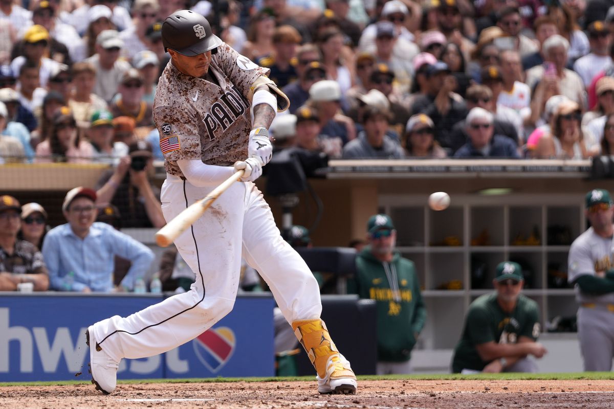Padres third baseman Manny Machado (13) hits the ball during an MLB baseball game against the Athletics, Sunday May 24, 2026 in San Diego, California.