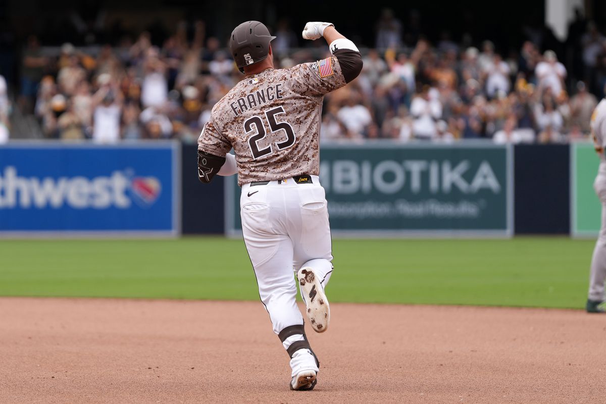 Padres first baseman Ty France (25) celebrates after hitting a home run during an MLB baseball game against the Athletics, Sunday May 24, 2026 in San Diego, California.