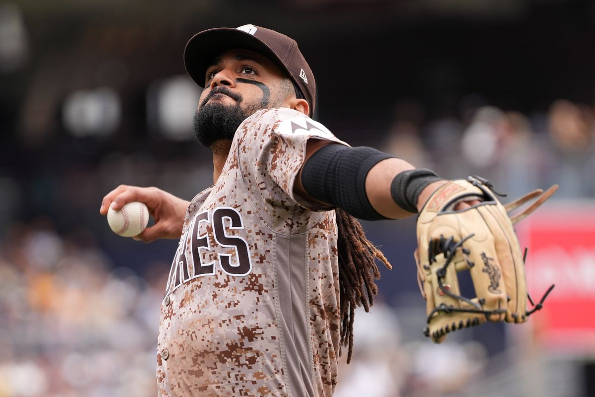 Padres right fielder Fernando Tatis Jr. (23) throws a ball into the stands at the bottom of the seventh inning during an MLB baseball game against the Athletics, Sunday May 24, 2026 in San Diego, California.