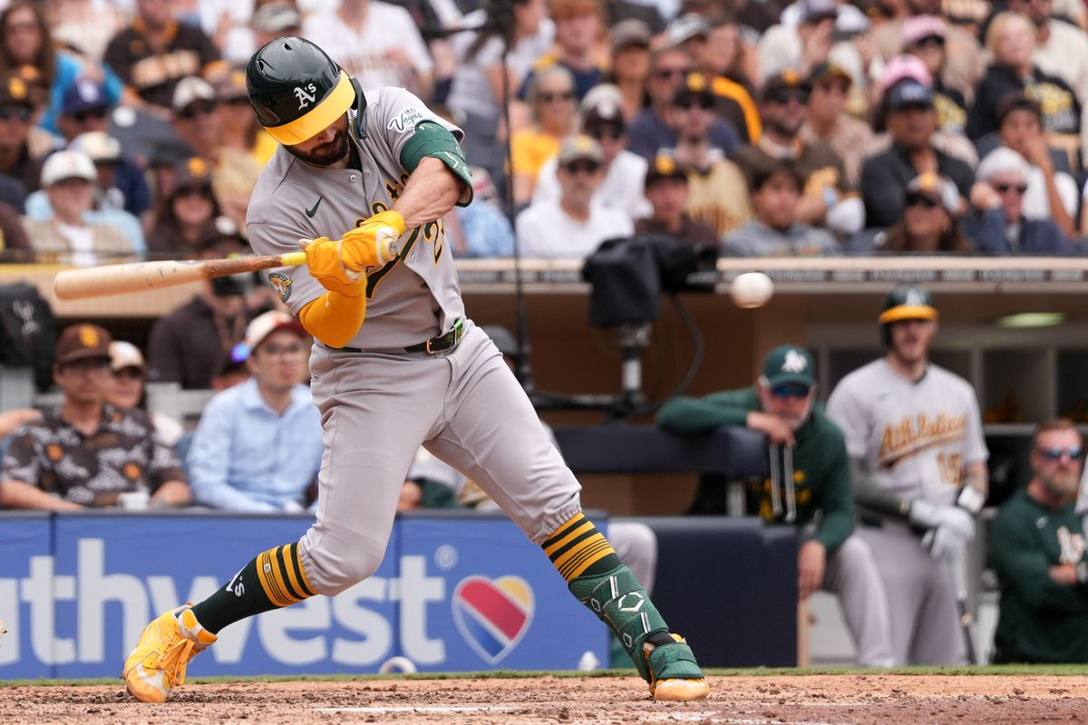 Athletics catcher Shea Langeliers (23) swings and misses the ball during an MLB baseball game against the Padres, Sunday May 24, 2026 in San Diego, California.
