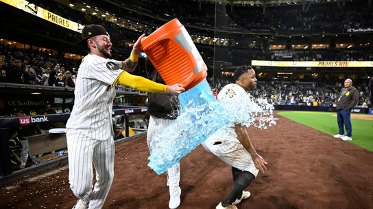 Apr 9, 2026; San Diego, California, USA; San Diego Padres center fielder Jackson Merrill (3) attempts to pour the contents of a beverage cooler over shortstop Xander Bogaerts (2) after Bogaerts hit a walk-off grand slam home run in the twelfth inning against the Colorado Rockies at Petco Park. Apr 9, 2026; San Diego, California, USA; San Diego Padres center fielder Jackson Merrill (3) attempts to pour the contents of a beverage cooler over shortstop Xander Bogaerts (2) after Bogaerts hit a walk-off grand slam home run in the twelfth inning against the Colorado Rockies at Petco Park.