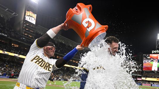 Apr 15, 2026; San Diego, California, USA; San Diego Padres first baseman Ty France, left, dumps a cooler over center fielder Jackson Merrill after he hit a walk-off double during the ninth inning against the Seattle Mariners at Petco Park. All MLB players are wearing number 42 today to honor Jackie Robinson. Apr 15, 2026; San Diego, California, USA; San Diego Padres first baseman Ty France, left, dumps a cooler over center fielder Jackson Merrill after he hit a walk-off double during the ninth inning against the Seattle Mariners at Petco Park. All MLB players are wearing number 42 today to honor Jackie Robinson.