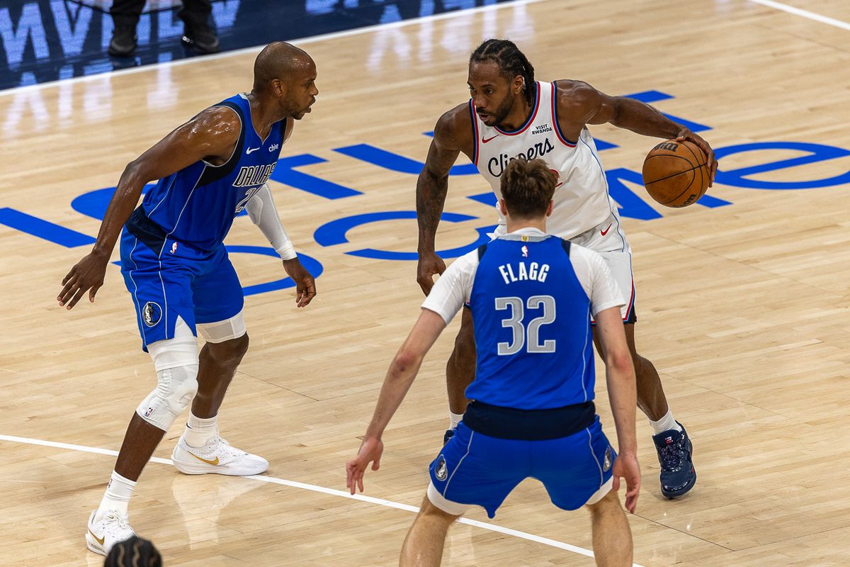 Los Angeles Clippers forward Kawhi Leonard (2) dribbles through defense during an NBA basketball game against the Dallas Mavericks, Tuesday April 7, 2026 in Inglewood, Calif.