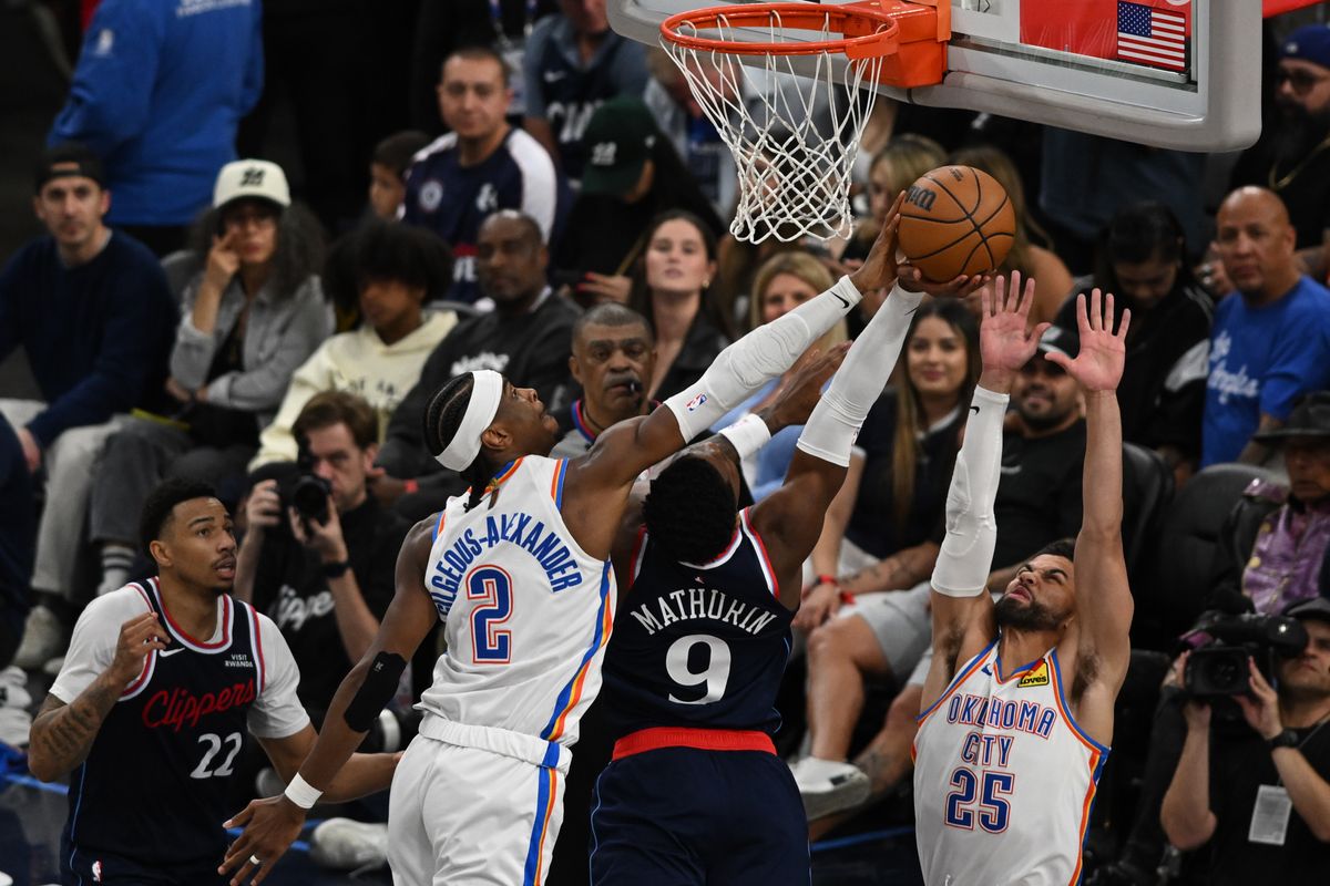 OKC Thunder guard Shai Gilgeous-Alexander (2) blocks a shot by LA Clippers guard Benedict Mathurin (9) during a game between the Los Angeles Clippers and OKC Thunder on Wednesday, April 8, 2026 at Intuit Dome in Inglewood Calif