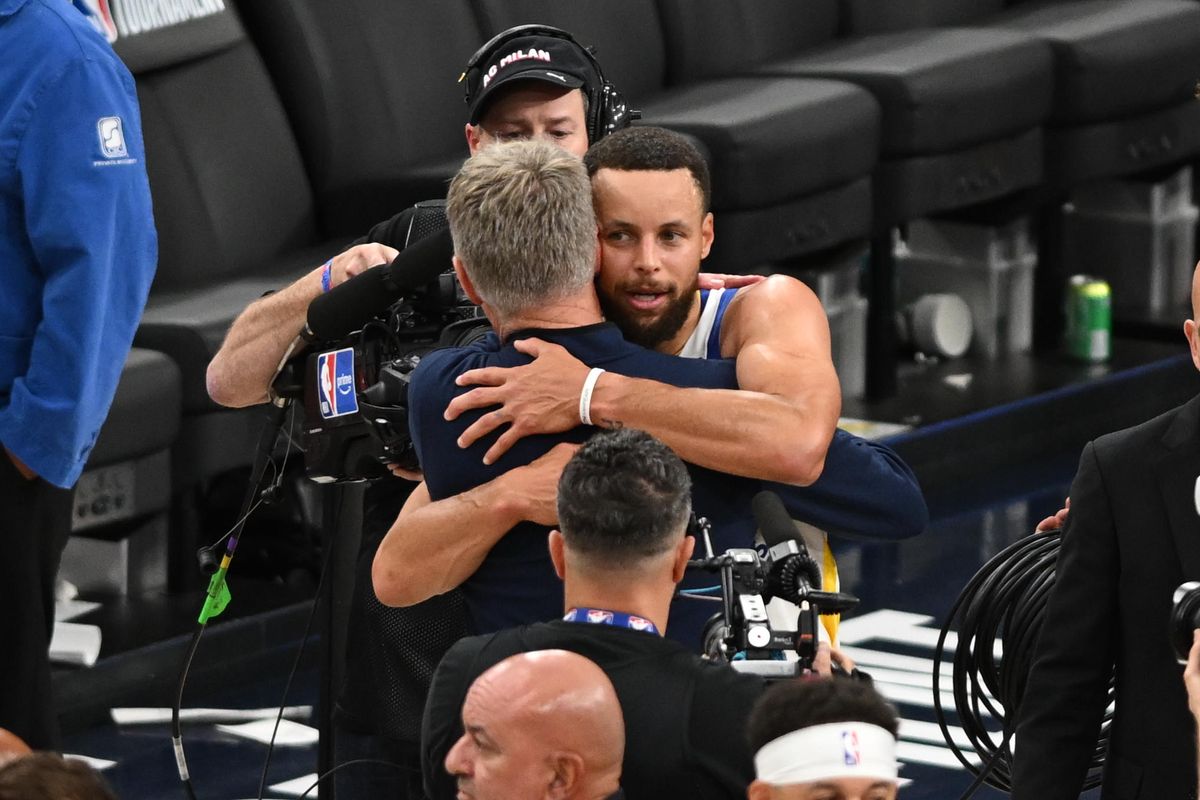 Golden State Warriors guard Steph Curry (30) hugs coach Steve Kerr after a game between the Los Angeles Clippers and Golden State Warriors on Wednesday, April 15, 2026 at Intuit Dome in Inglewood Calif