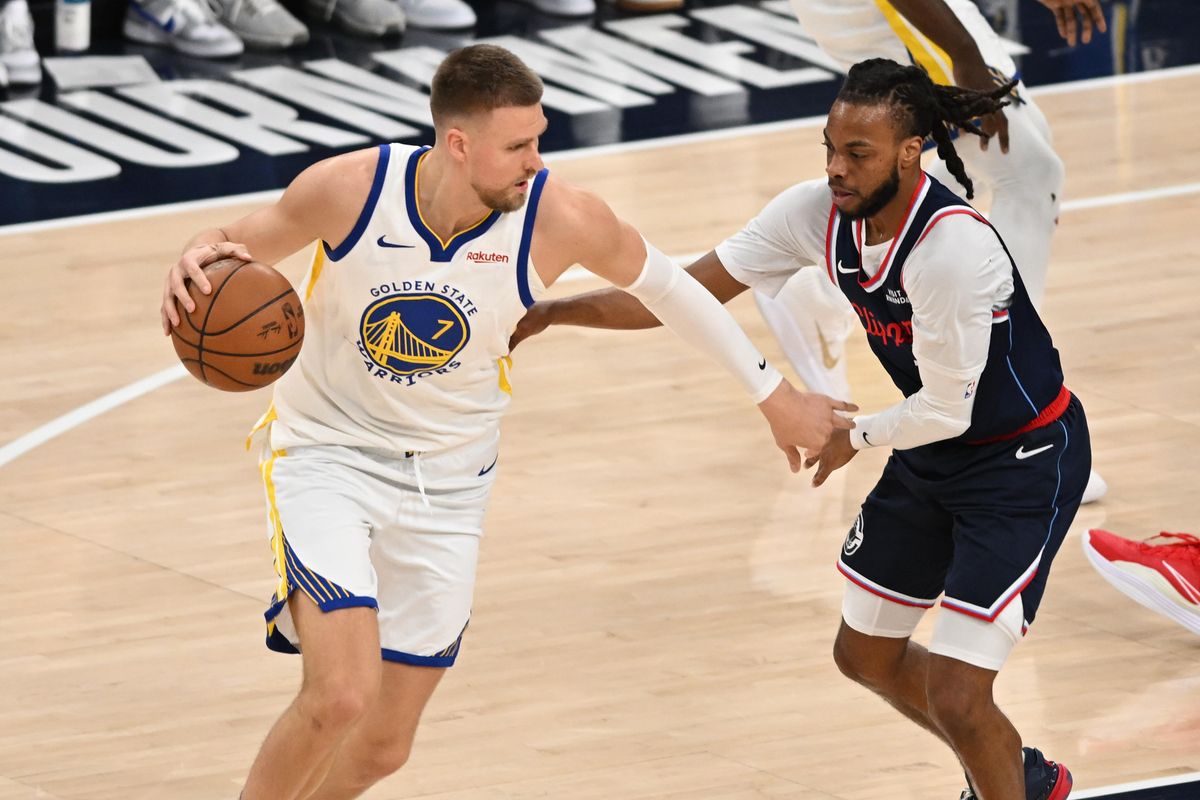 Golden State Warriors center Kristaps Porziņģis (7) dribbles the ball during a game between the Los Angeles Clippers and Golden State Warriors on Wednesday, April 15, 2026 at Intuit Dome in Inglewood Calif