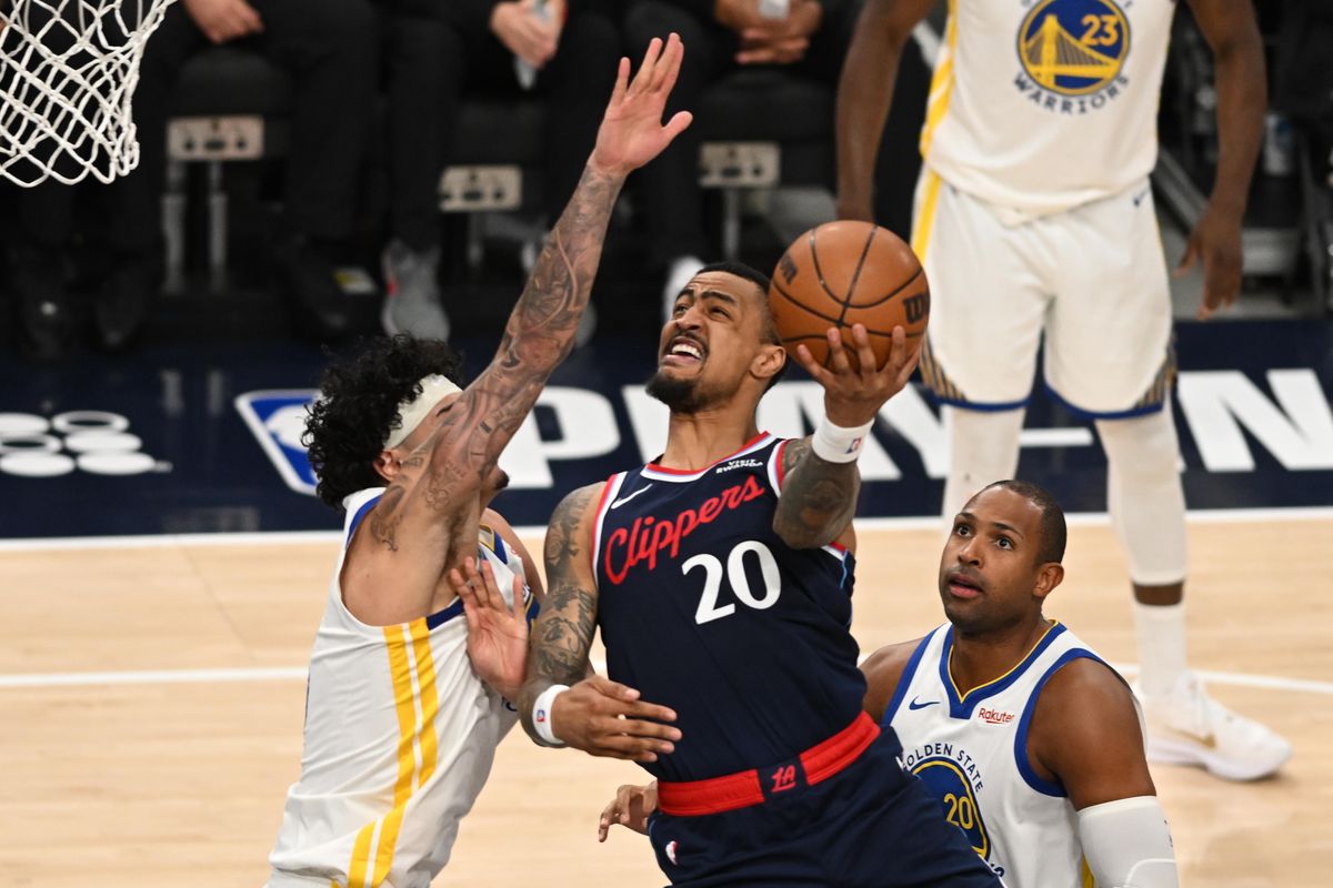 Los Angeles Clippers forward John Collins (20) makes a move under the basket during a game between the Los Angeles Clippers and Golden State Warriors on Wednesday, April 15, 2026 at Intuit Dome in Inglewood Calif