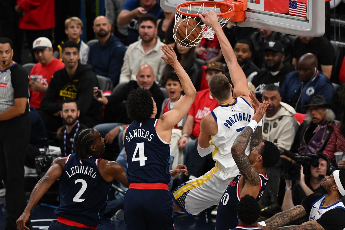 Golden State Warriors center Kristaps Porziņģis (7) dunks the ball during a game between the Los Angeles Clippers and Golden State Warriors on Wednesday, April 15, 2026 at Intuit Dome in Inglewood Calif