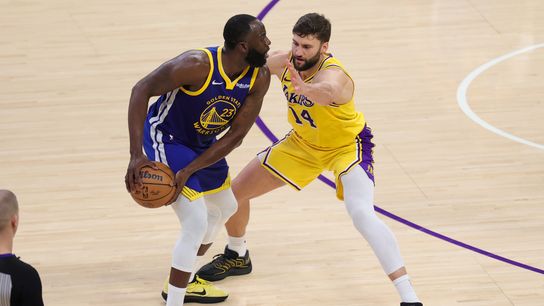 Los Angeles Lakers forward Maxi Kleber (14) defends against Golden State Warriors forward Draymond Green (23) during an NBA game on February 7, 2025 in Los Angeles, CA. Los Angeles Lakers forward Maxi Kleber (14) defends against Golden State Warriors forward Draymond Green (23) during an NBA game on February 7, 2025 in Los Angeles, CA.