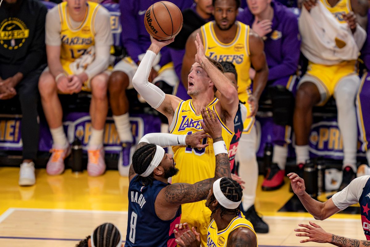 Los Angeles Lakers guard Luke Kennard (10) shooting for three points during an NBA basketball game against the Washington Wizards on March 30th, 2026 in Los Angeles, CA.