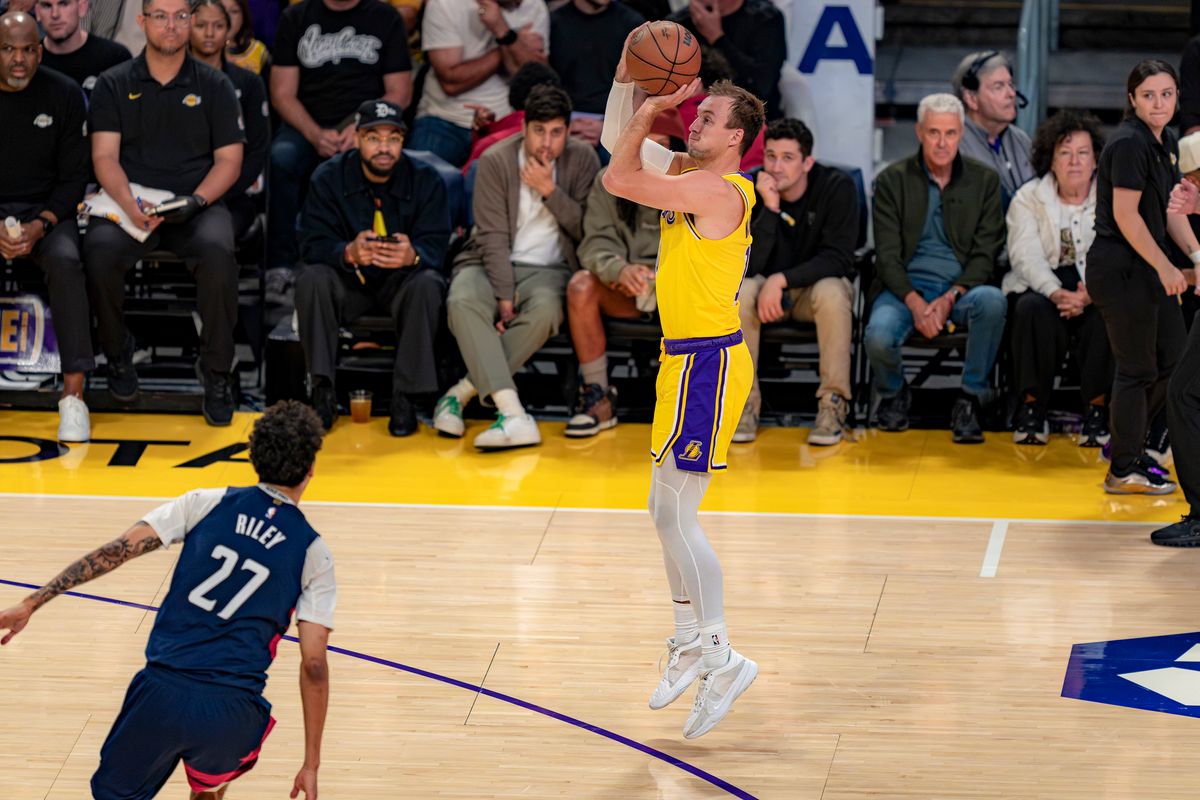 Los Angeles Lakers guard Luke Kennard (10) shooting for three during an NBA basketball game against the Washington Wizards on March 30th, 2026 in Los Angeles, CA.