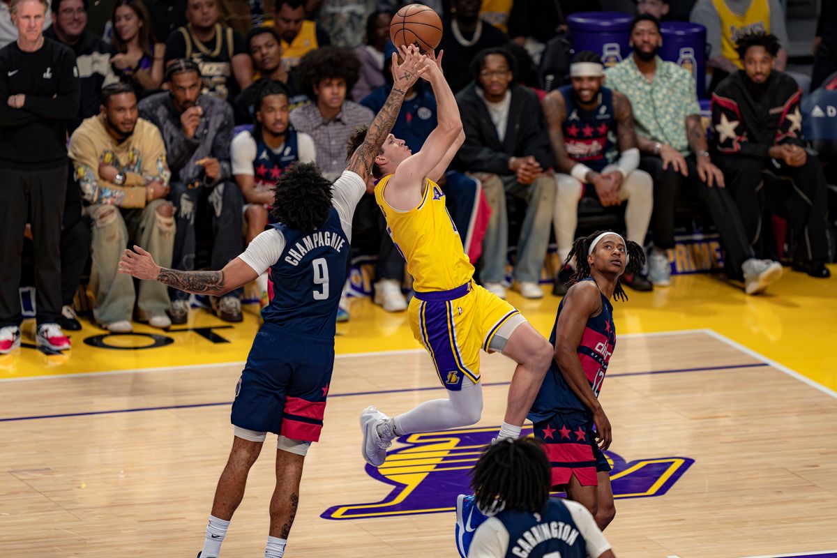 Los Angeles Lakers guard Austin Reaves (15) being fouled during an NBA basketball game against the Washington Wizards on March 30th, 2026 in Los Angeles, CA.