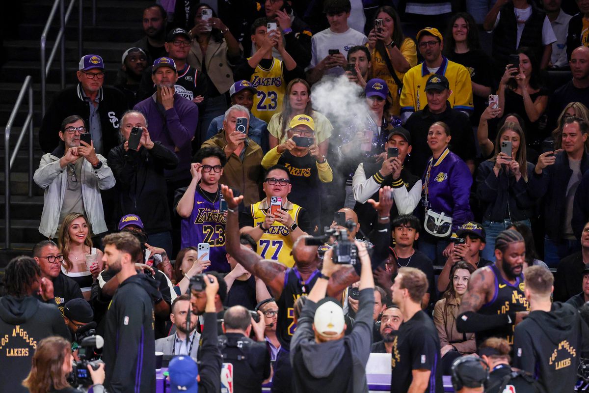 Fans look on as LeBron James #23 of the Los Angeles Lakers throws chalk in the air before an NBA basketball game against the Cleveland Cavaliers, Tuesday March 31, 2026 in Los Angeles, Calif.