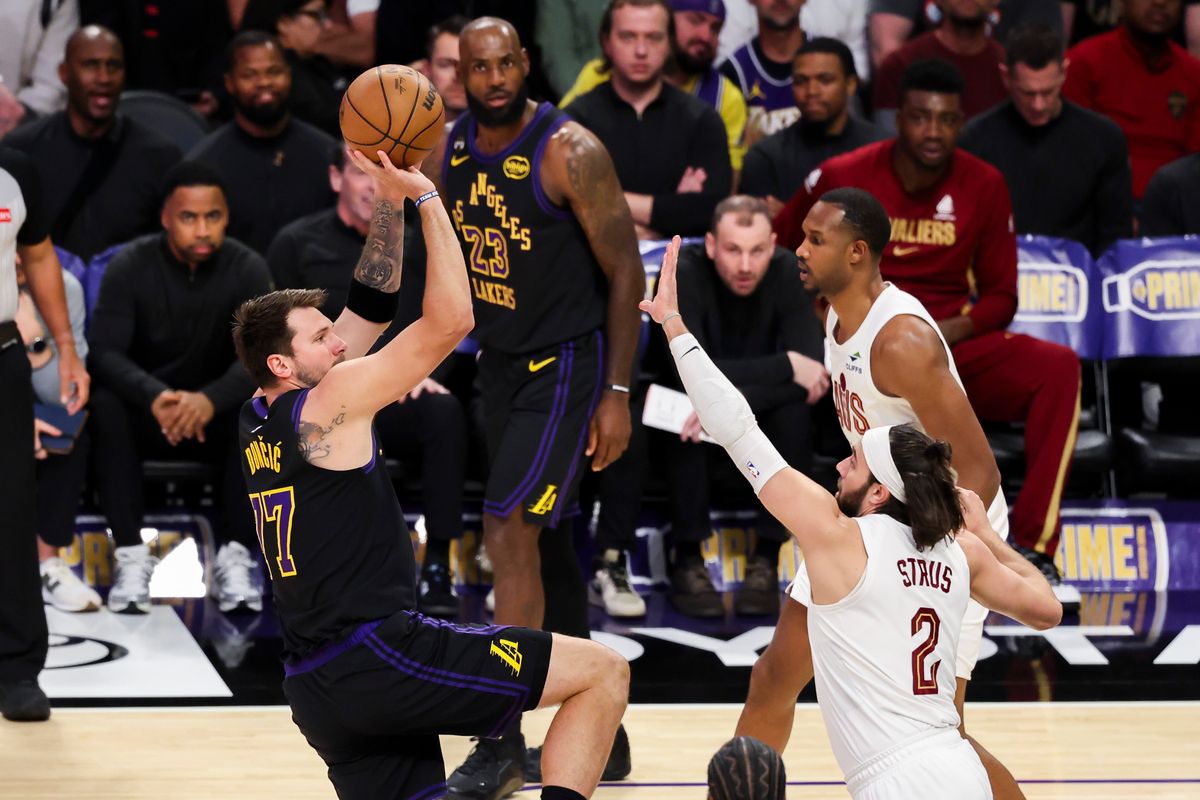 Luka Doncic #77 of the Los Angeles Lakers shoots the ball over Max Strus #2 of the Cleveland Cavaliers during an NBA basketball game, Tuesday March 31, 2026 in Los Angeles, Calif.