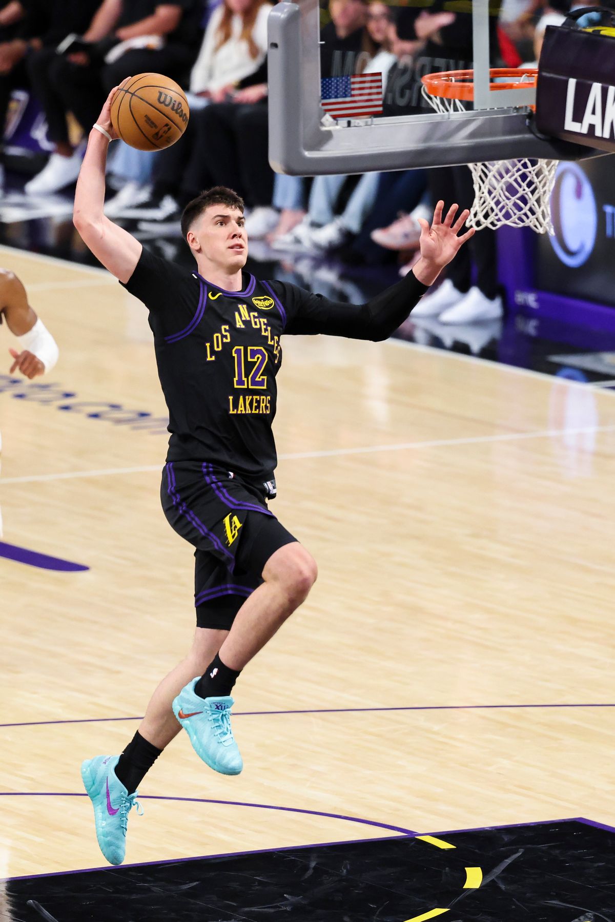 Jake LaRavia #12 of the Los Angeles Lakers dunks the ball during an NBA basketball game against the Cleveland Cavaliers, Tuesday March 31, 2026 in Los Angeles, Calif.