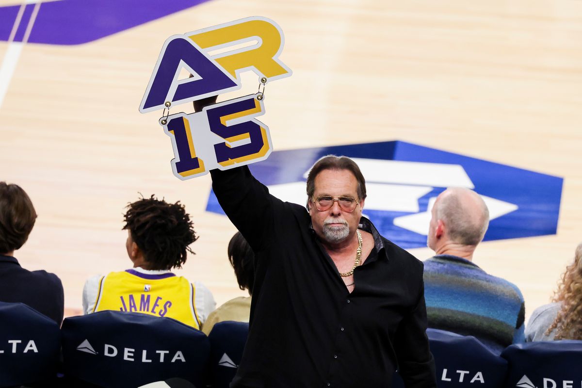 Lakers fan Gary Martin Zelman holds a sign for Austin Reaves in the crowd during an NBA basketball game between the Los Angeles Lakers and Cleveland Cavaliers, Tuesday March 31, 2026 in Los Angeles, Calif.