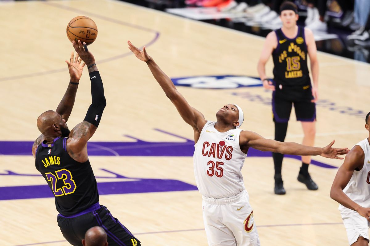 LeBron James #23 of the Los Angeles Lakers shoots the ball over Nae’Qwan Tomlin #35 of the Cleveland Cavaliers during an NBA basketball game, Tuesday March 31, 2026 in Los Angeles, Calif.
