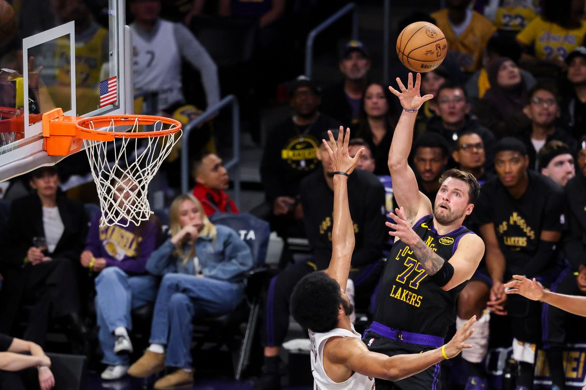 Luka Doncic #77 of the Los Angeles Lakers tosses a lob towards the rim during an NBA basketball game against the Cleveland Cavaliers, Tuesday March 31, 2026 in Los Angeles, Calif.