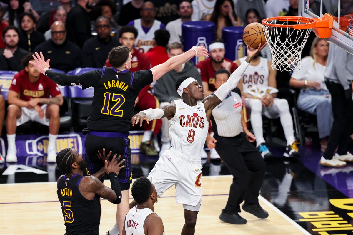 Dennis Schroder #8 of the Cleveland Cavaliers lays the ball up past Jake LaRavia #12 of the Los Angeles Lakers during an NBA basketball game, Tuesday March 31, 2026 in Los Angeles, Calif.