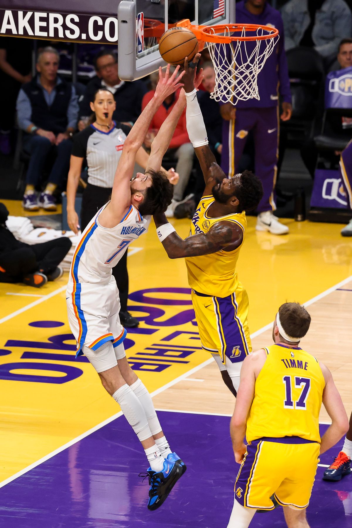 Chet Holmgren #7 of the Oklahoma City Thunder and Deandre Ayton #5 of the Los Angeles Lakers reach for the ball during an NBA basketball game, Tuesday April 7, 2026 in Los Angeles, Calif.