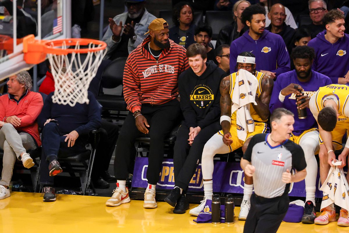 LeBron James #23 and Austin Reaves #15 of the Los Angeles Lakers smile on the bench during an NBA basketball game against the Oklahoma City Thunder, Tuesday April 7, 2026 in Los Angeles, Calif.
