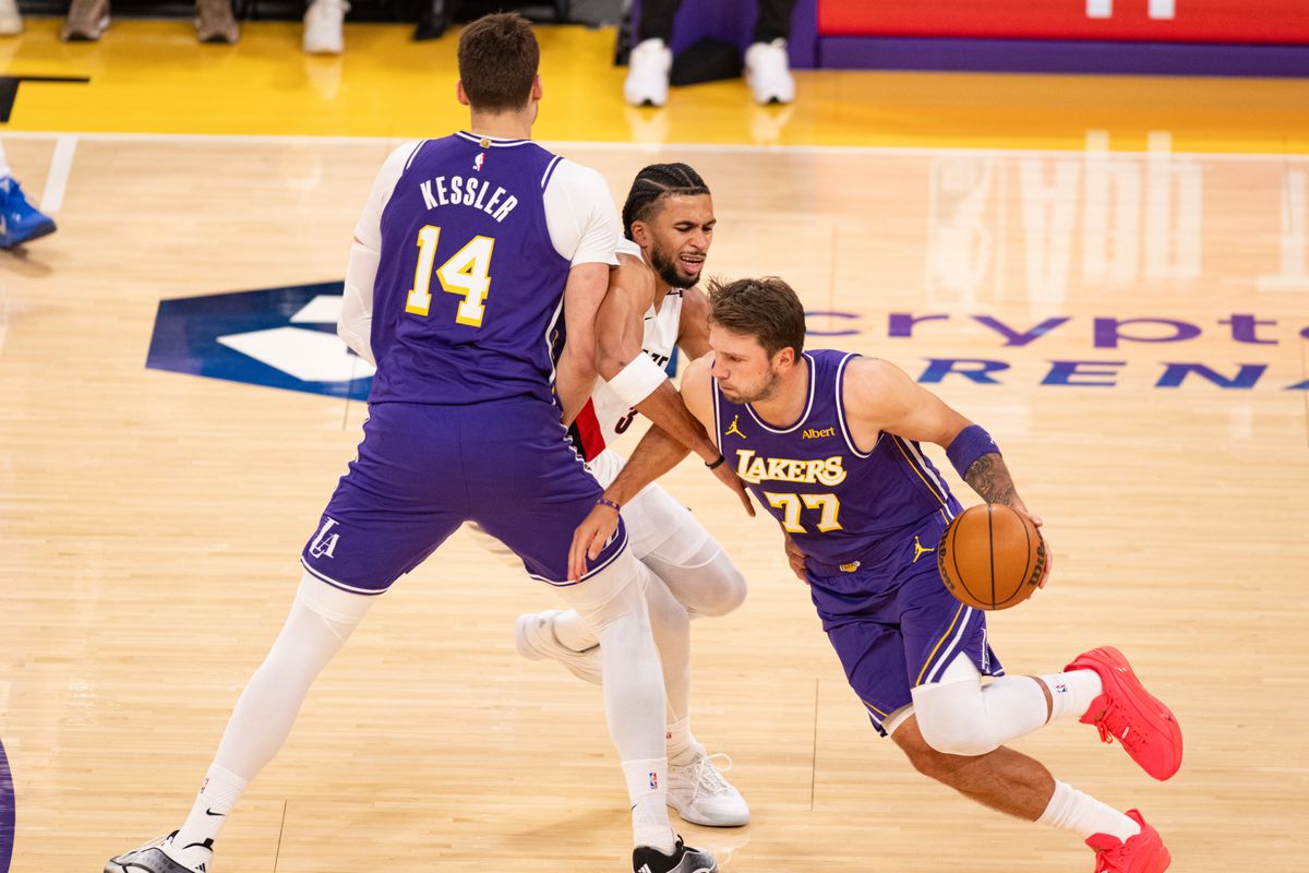 Los Angeles Lakers guard Luka Doncic (77) moves around a screen and drives to the basket during an NBA basketball game against Portland Trailblazers, Tuesday, October 27, 2026 in Los Angeles.