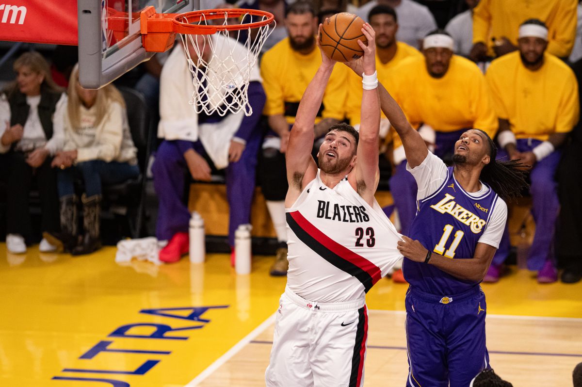Los Angeles Lakers forward Ziaire Williams (11) fights for the rebound against Portland Trailblazers center Donovan Clingan (23) during an NBA basketball game against Portland Trailblazers, Tuesday, October 27, 2026 in Los Angeles.