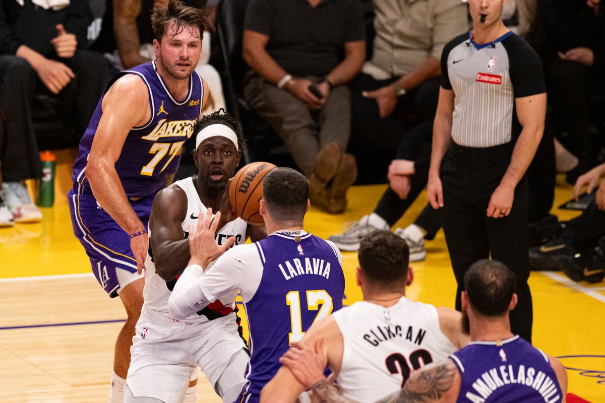 Portland Trailblazers guard Jrue Holiday (5) drives down the baseline during an NBA basketball game against Los Angeles Lakers, Tuesday, October 27, 2026 in Los Angeles.
